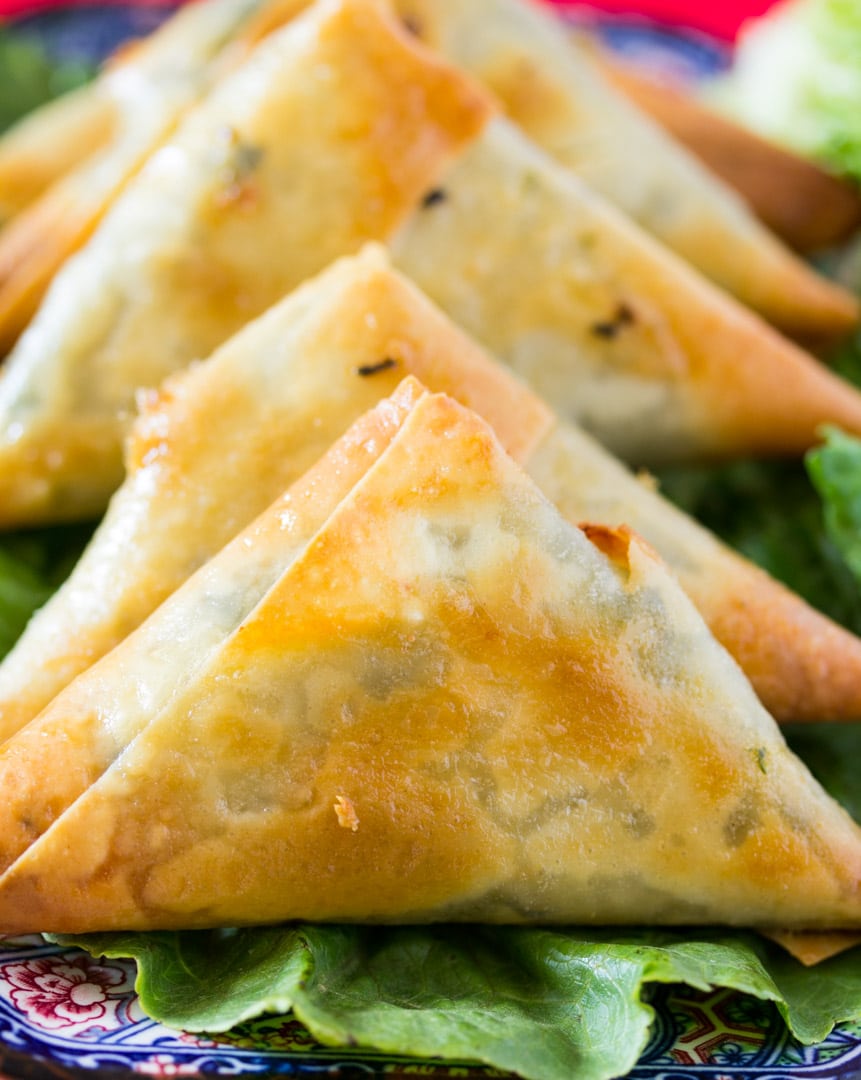 Close up of baked spinach and feta cheese samosa