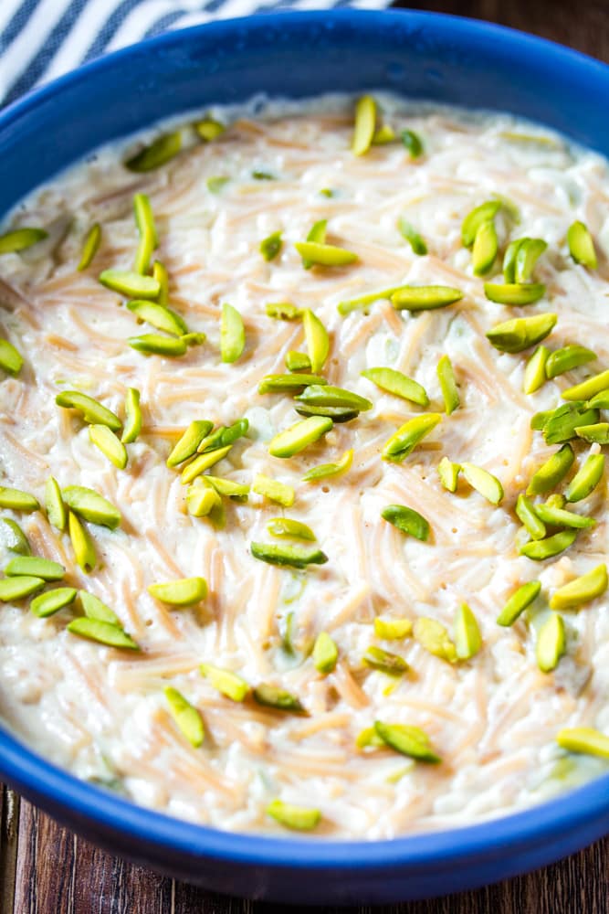 Close up shot of Pakistani sevai kheer made with milk and sprinkled with pistachios.