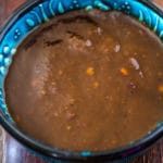 Close up shot of tamarind sauce in a blue bowl