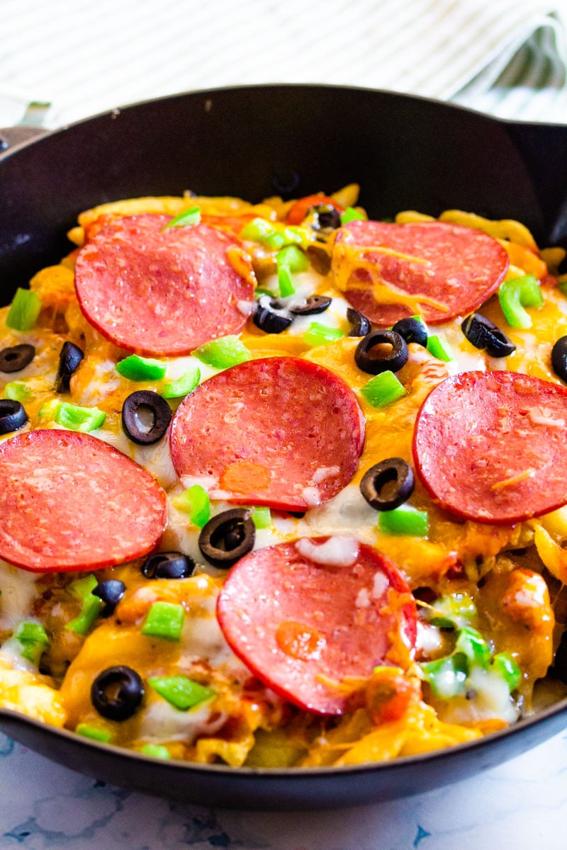 baked pizza fries in a black cast iron pan.