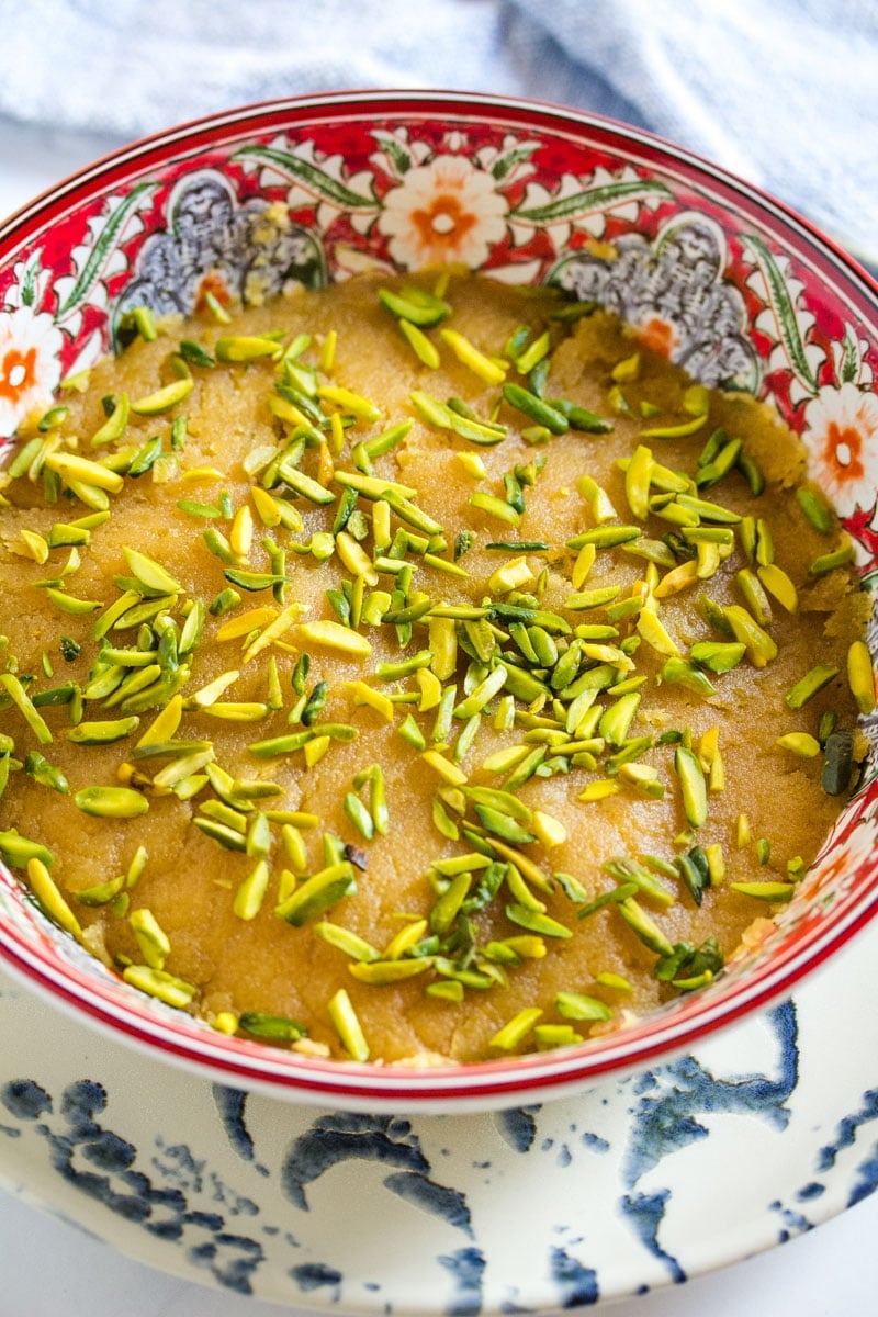Pakistani mithai made with chickpea flour and ghee, topped with pistachio nuts.