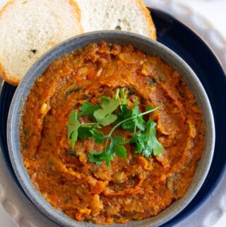 Overhead shot of moroccan eggplant salad served with bread.