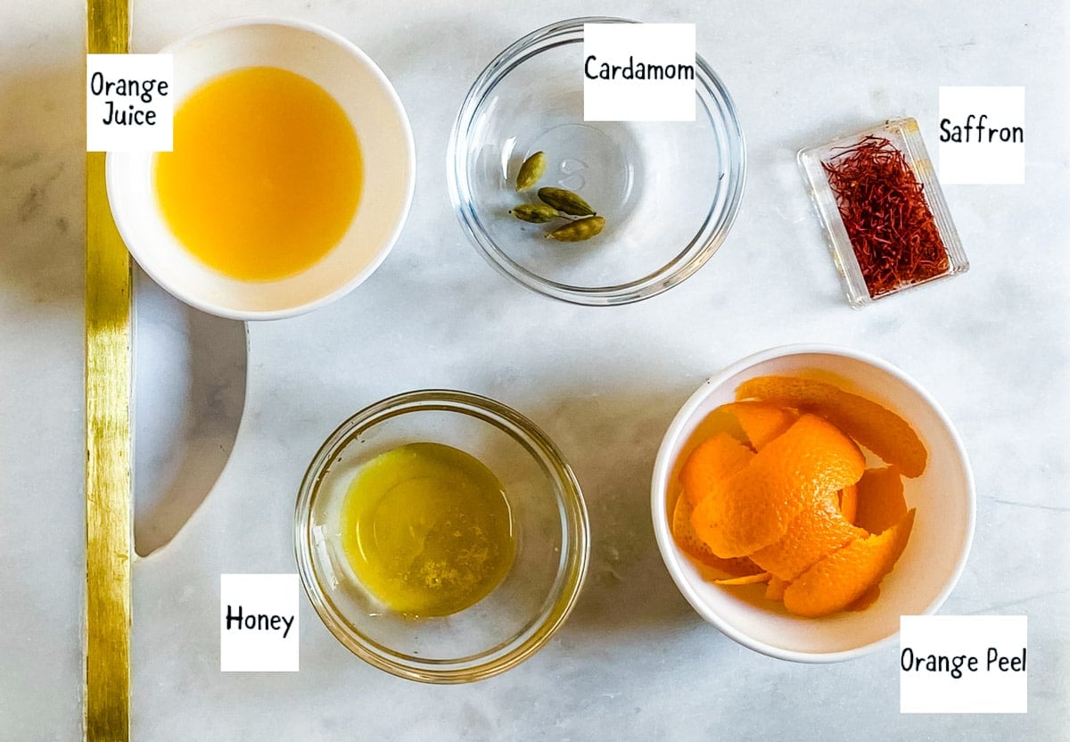 Labelled ingredients needed to make orange tea.