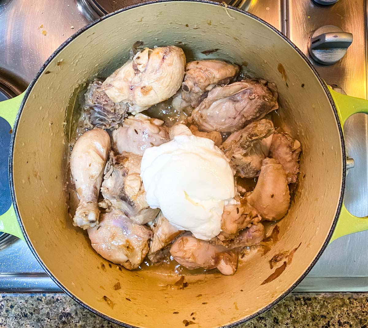 Making chicken pulao in a dutch oven pot.