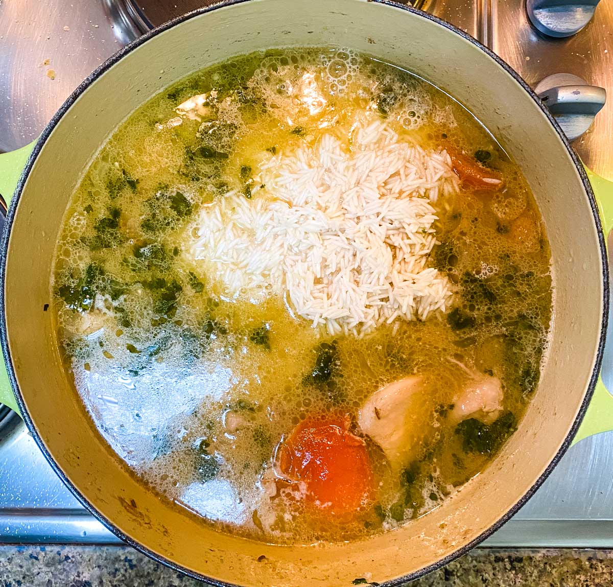 Ingredients for chicken pulao in a pot ready to be cooked together.