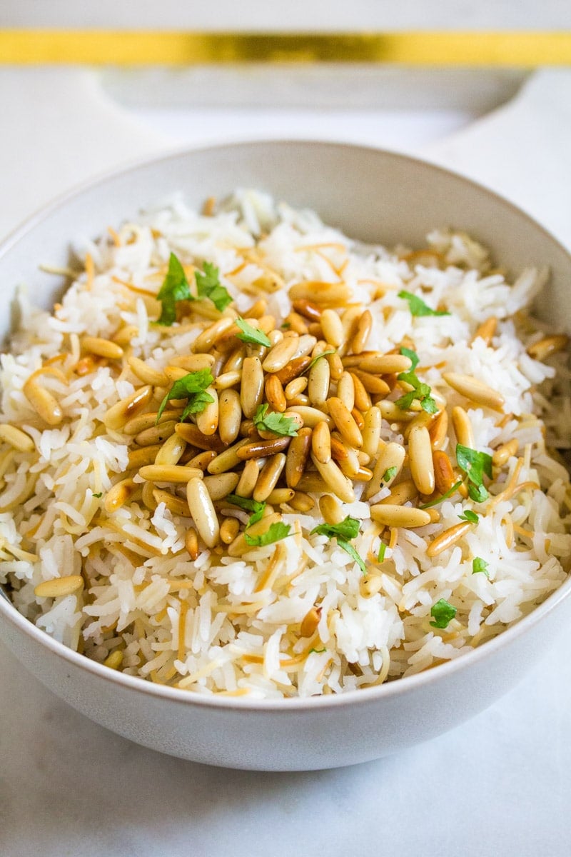 Close up shot of Lebanese Vermicelli Rice topped with toasted pine nuts.