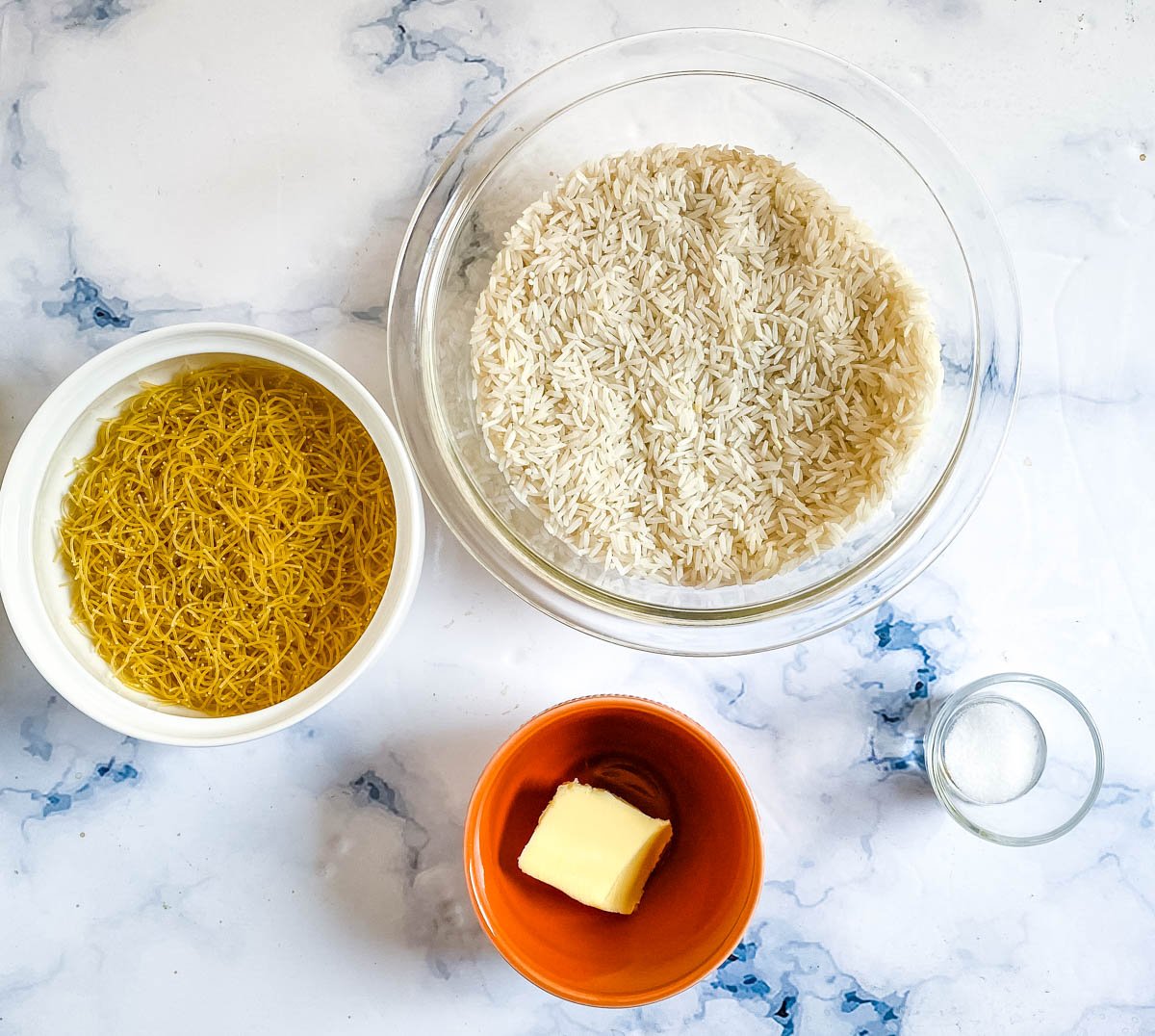 Ingredients needed to make Lebanese Rice: basmati rice, vermicelli pasta, butter, and salt. 