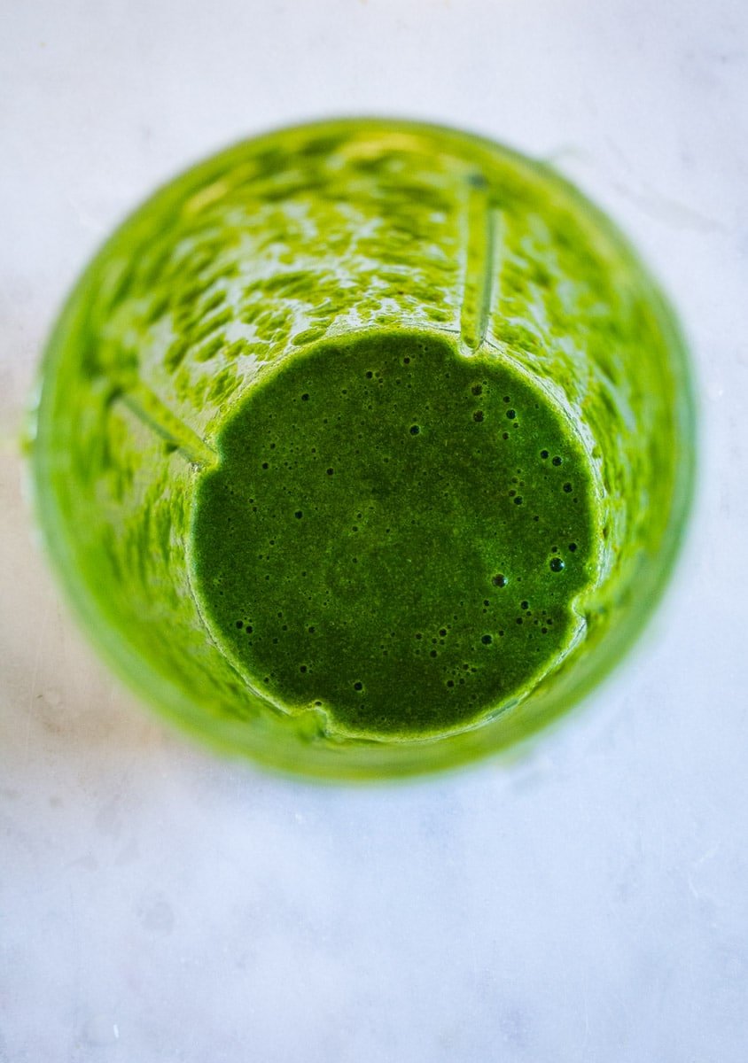 Blended mint sauce in a blender jar.