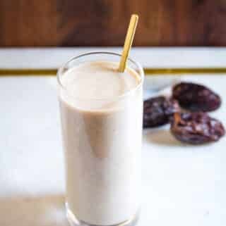 Date milkshake with dates in background.