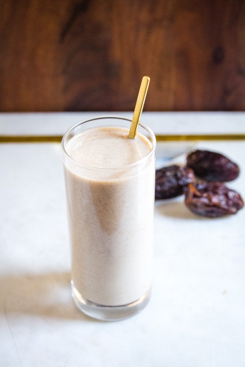 Date milkshake with dates in background.