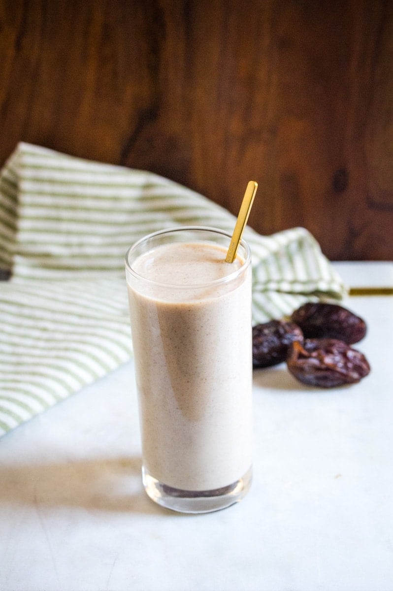 Date milkshake with dates in background.