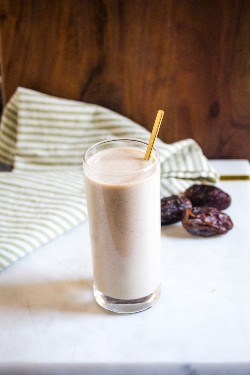 Date milkshake with dates in background.