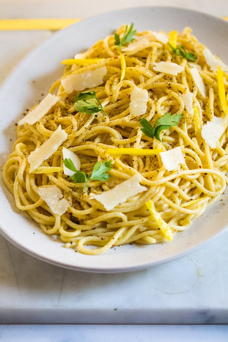 Lemon pepper pasta served on a white platter.